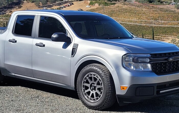 Lowered Silver Maverick Hybrid w/ big boots (245-65-17 Falken Wildpeak Trail tires on 17" Sparco Gravel wheels)