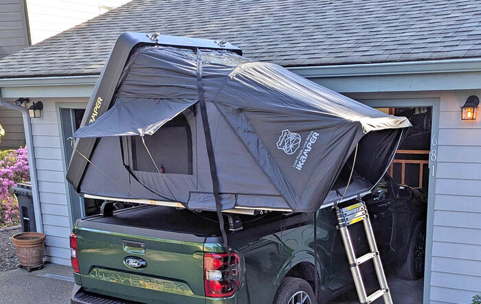 RTT iKamper roof top tent with Thule Aerobars over a BAK Revolver X4S with tracks.